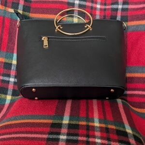Elegant Black Handbag with Gold Accents